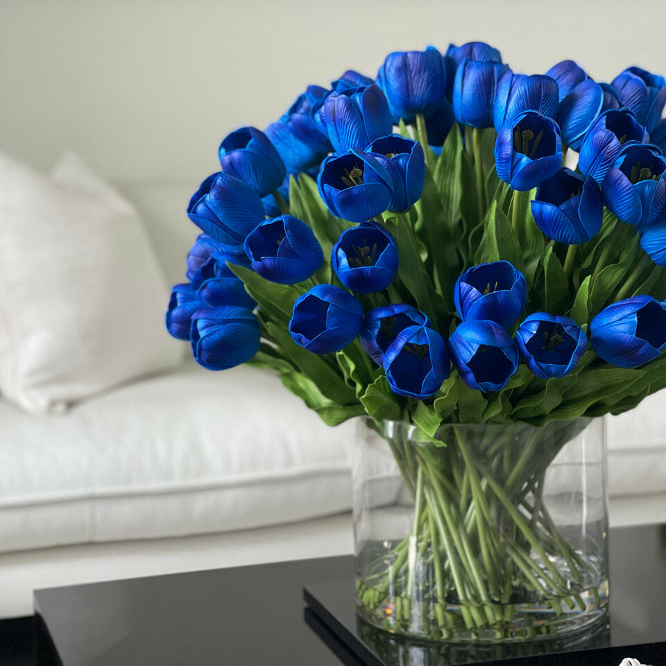 Blue Tulip Arrangement in a Large Cylindrical Vase