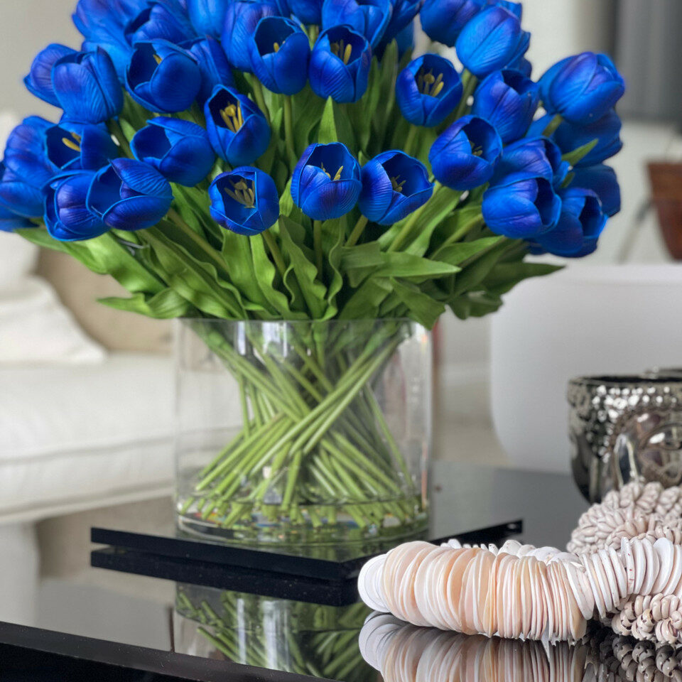 Blue Tulip Arrangement in a Large Cylindrical Vase