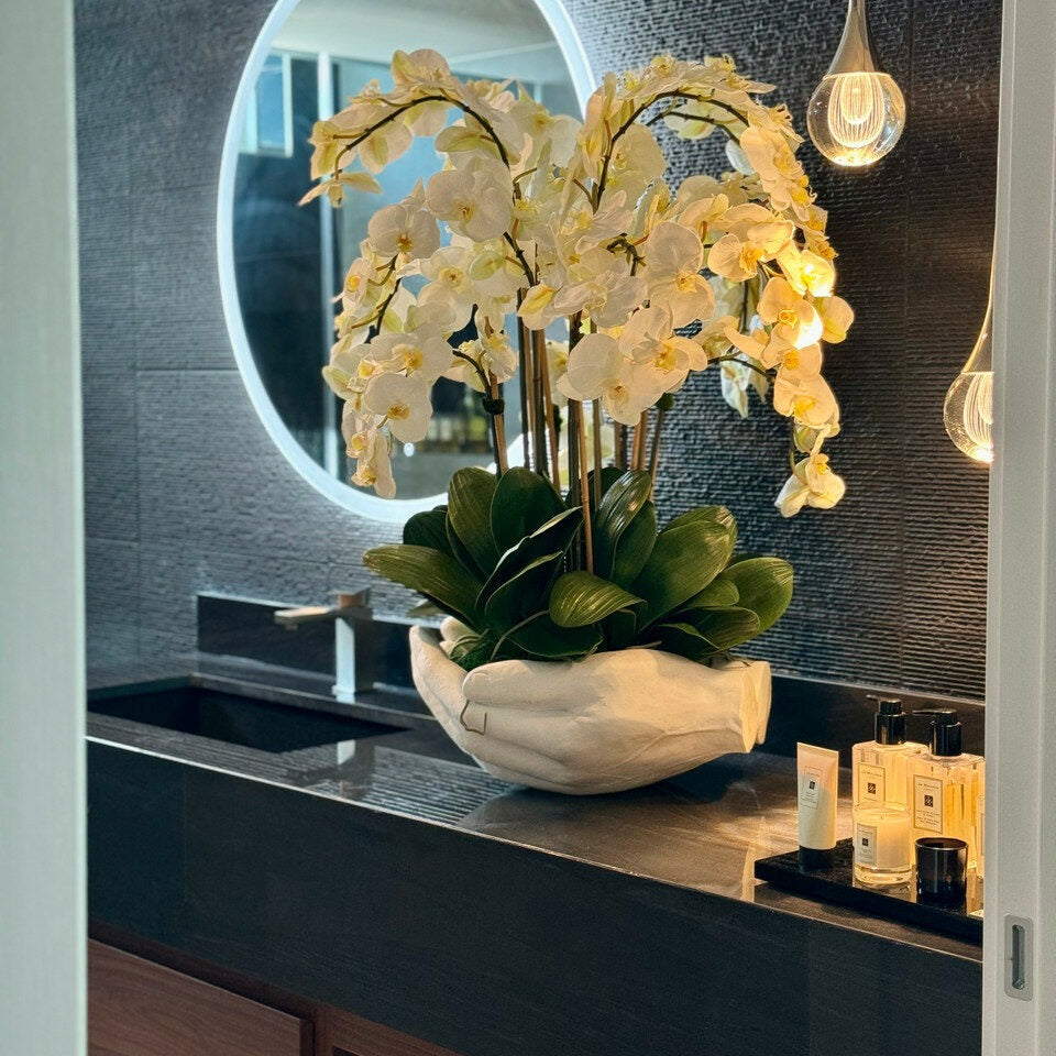 White Phalaenopsis Orchids in an Open Hands Sculptural Vase